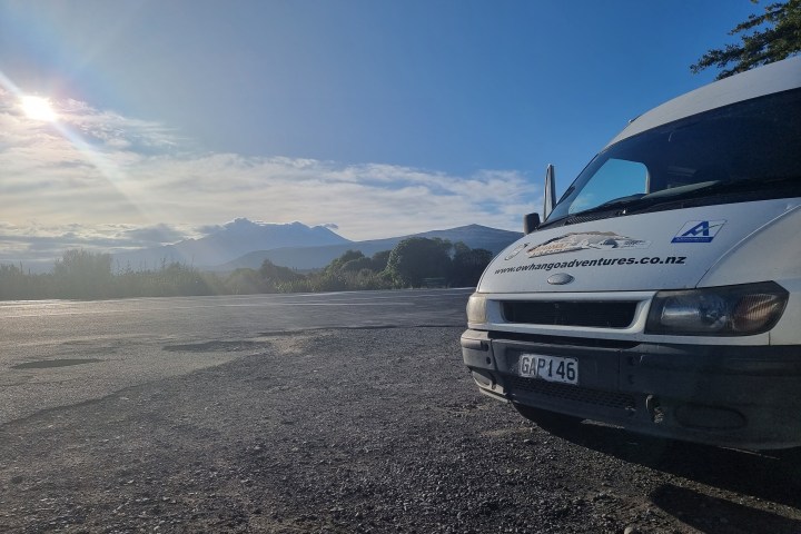 a bus that is sitting on the side of a mountain